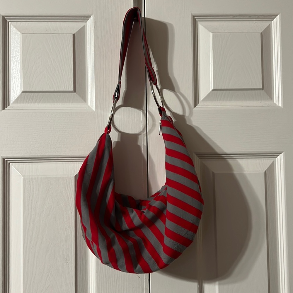5 for $25💵 Red and gray striped hand bag.
